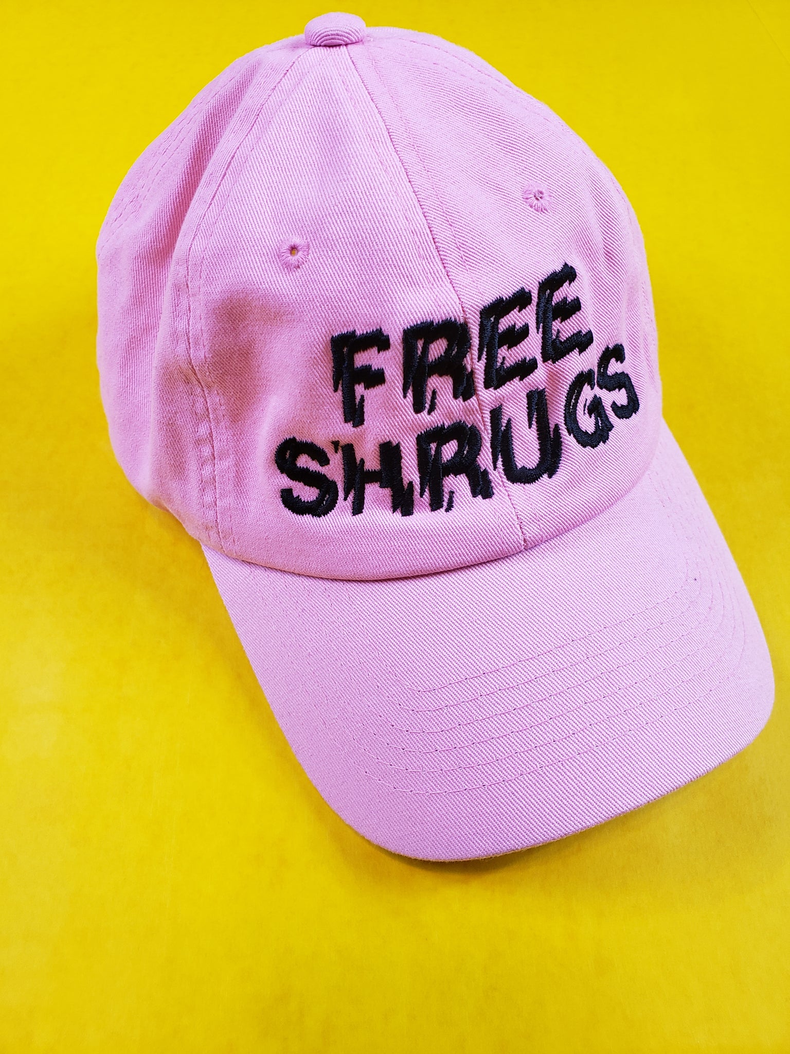 "FREE SHRUGS" DAD HAT